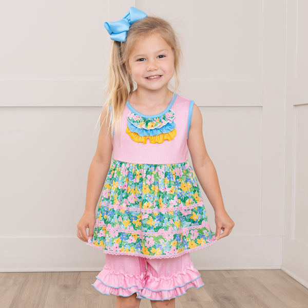 young girl wearing floral outfit