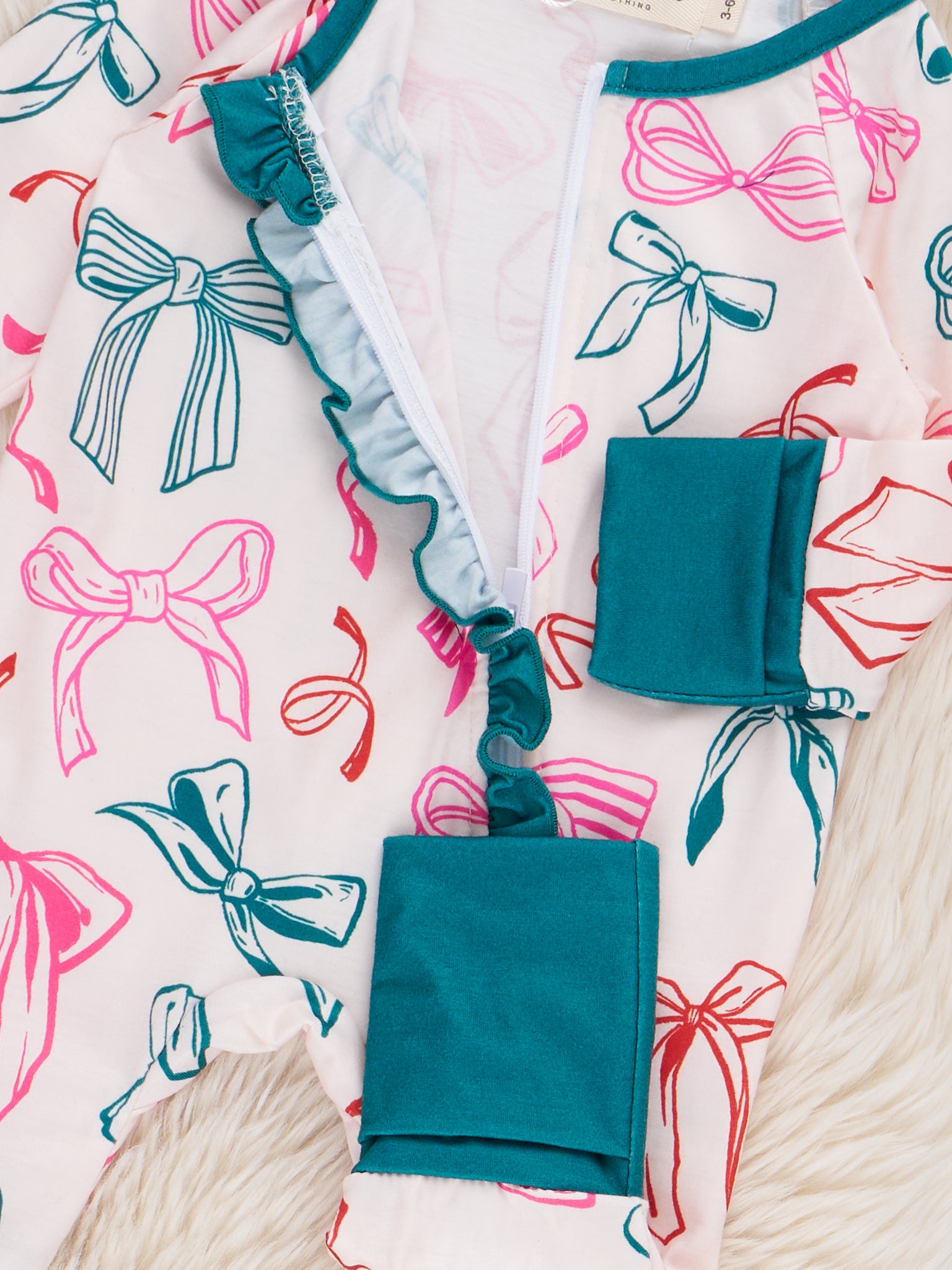 Jolly Bowtie Ruffle Sleeper Pajamas - Marie Nicole Clothing