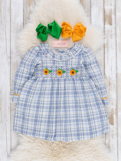 blue and yellow sunflower dress When it comes to summer vibes, our Michelle Sunflower Dress has got you covered. It brings all the sunshine, colour and good vibes this season, the kind that make you want
