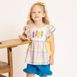 young girl wears back to school outfit