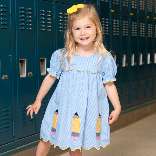 young girl wears back to school dress