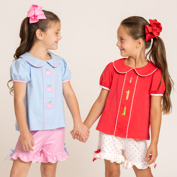 young girls wearing back to school outfits