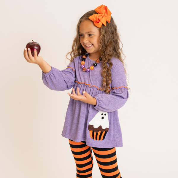 girl wearing halloween outfit