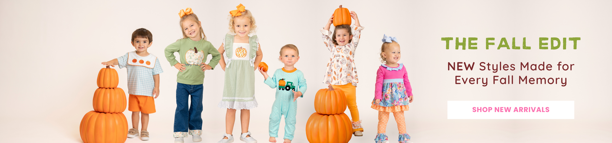A promotional banner for 'The Fall Edit' featuring six children modeling various autumn-themed outfits and costumes, including pumpkin costumes, a turtle costume, and a pink dress, standing next to orange pumpkins against a white background. Text on the right reads 'THE FALL EDIT NEW Styles Made for Every Fall Memory' with a 'SHOP NEW ARRIVALS' button.