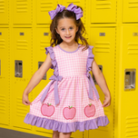 young girl wears apple gingham dress