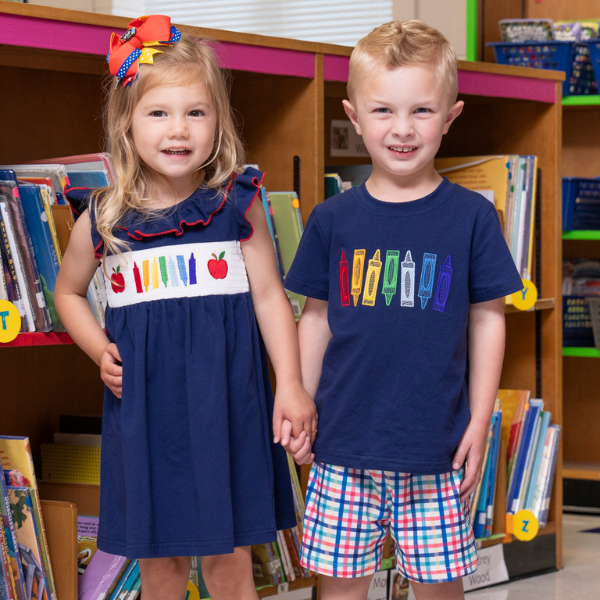Young boy and girl wearing matching back to school set 