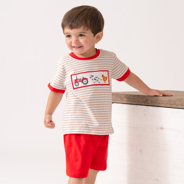 young boy wearing farm outfit