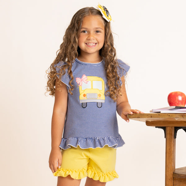 girl wearing school bus outfit