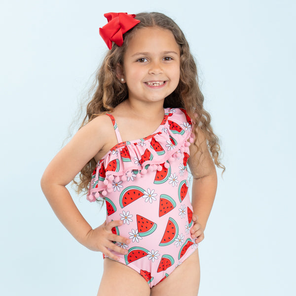young girl wearing watermelon swimsuit