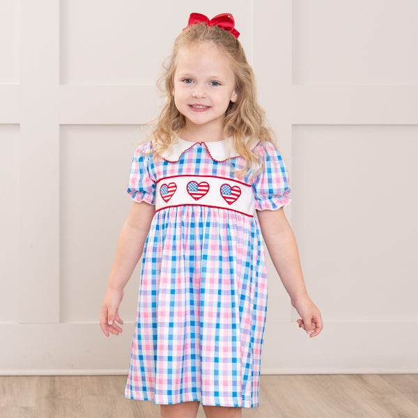 young girl wears patriotic dress