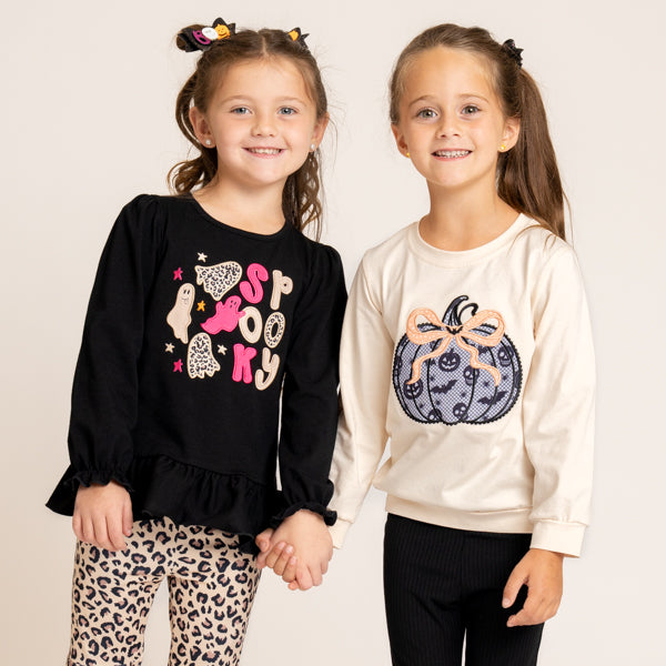 two girls with halloween outfits