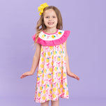 young girl wears lemon dress