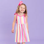 young girl wears striped summer dress