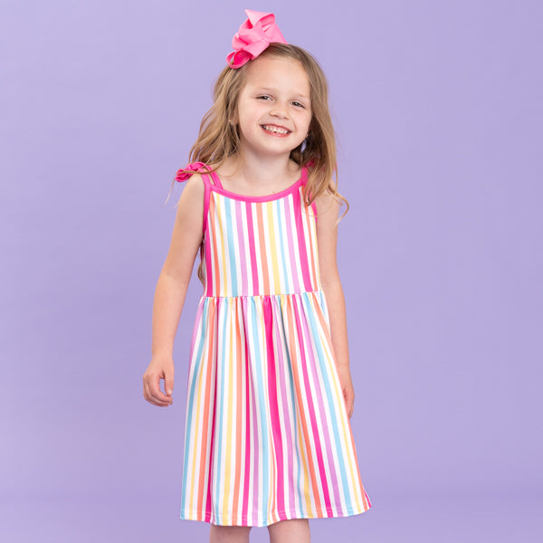 young girl wears striped dress for summer