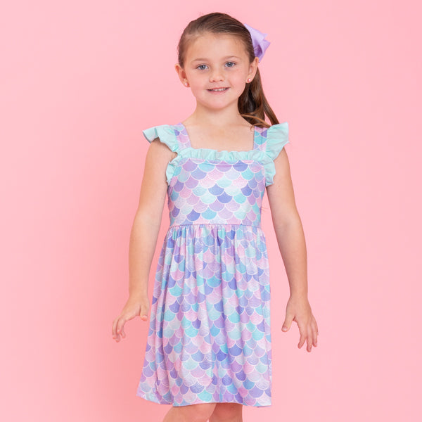 young girl wears mermaid dress