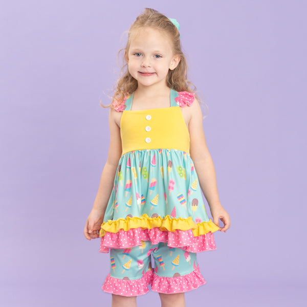 young girl wears popsicle outfit
