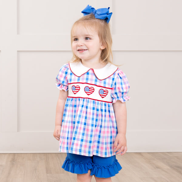 young girl wears gingham patriotic outfit