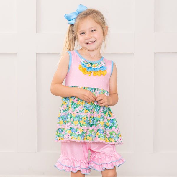 young girl wears floral outfit