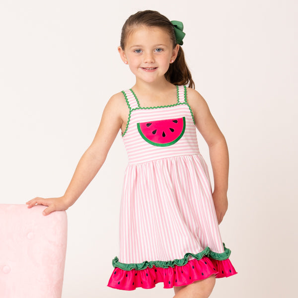 young girl wearing watermelon dress