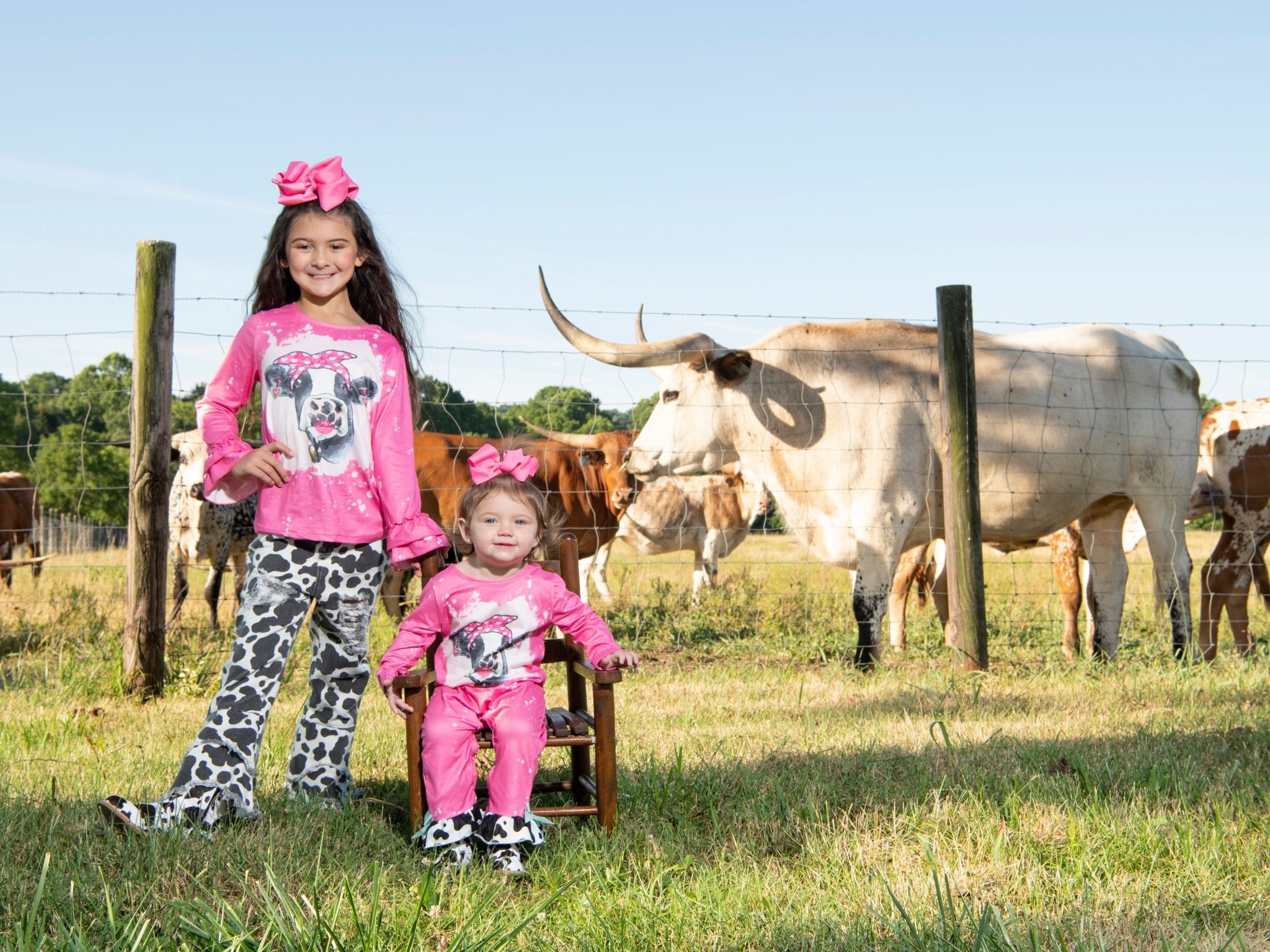 Pink Bleached Cow Top & Distressed Pants Outfit - Marie Nicole Clothing