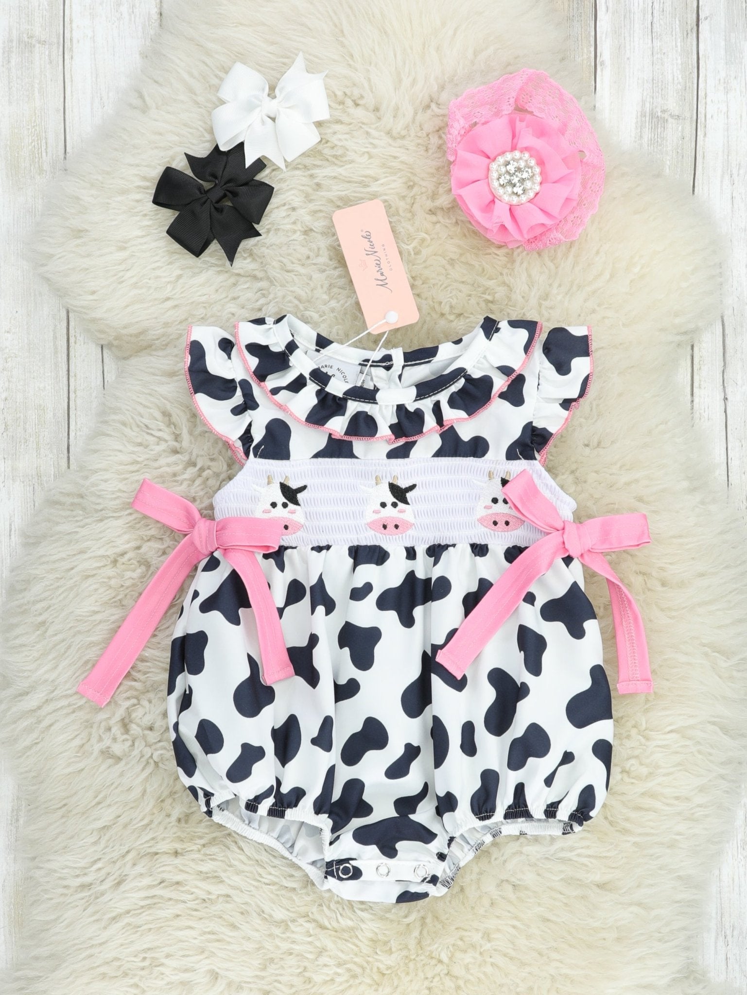 Smocked Cow Print Bow Ruffle Romper - Marie Nicole Clothing